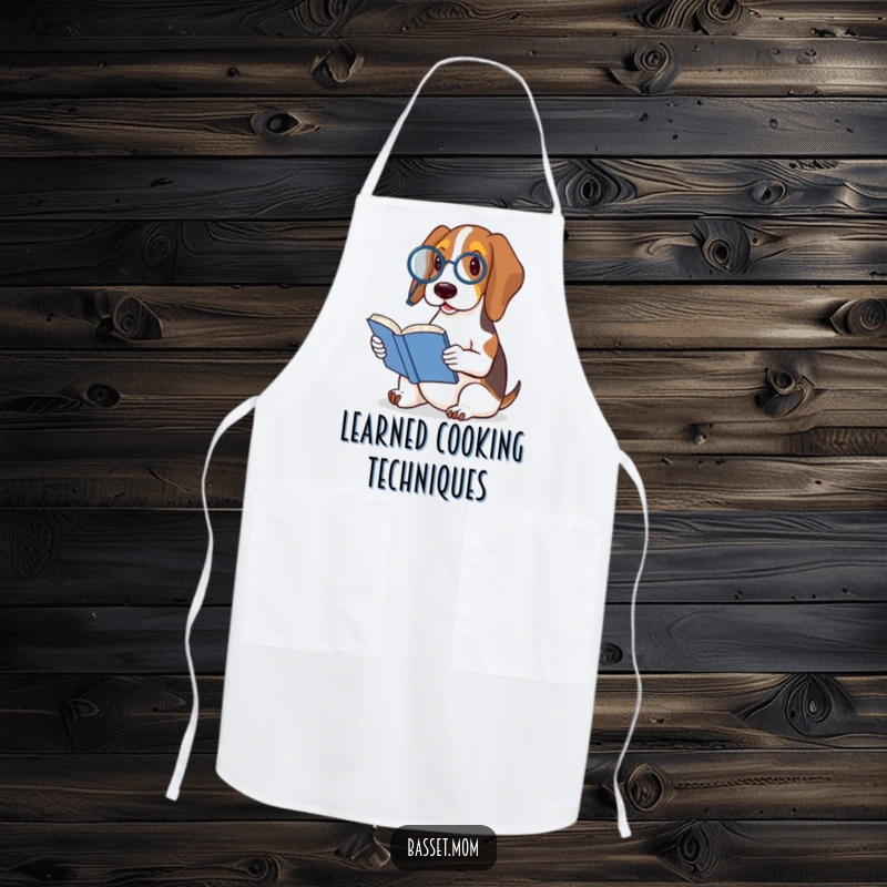 Funny Basset Hound apron showing a dog in a monocle reading a tiny book, blending culinary practicality with humorous sophistication.