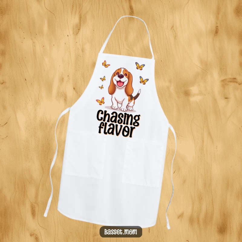 Funny Basset Hound apron with a dog sporting a silly grin, playfully leaping after butterflies, bringing a humorous touch to cooking.