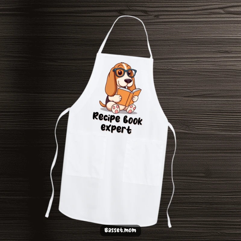 Funny Basset Hound apron, a dog wearing glasses reading a book, ideal for a humorous and intellectual kitchen accessory gift.