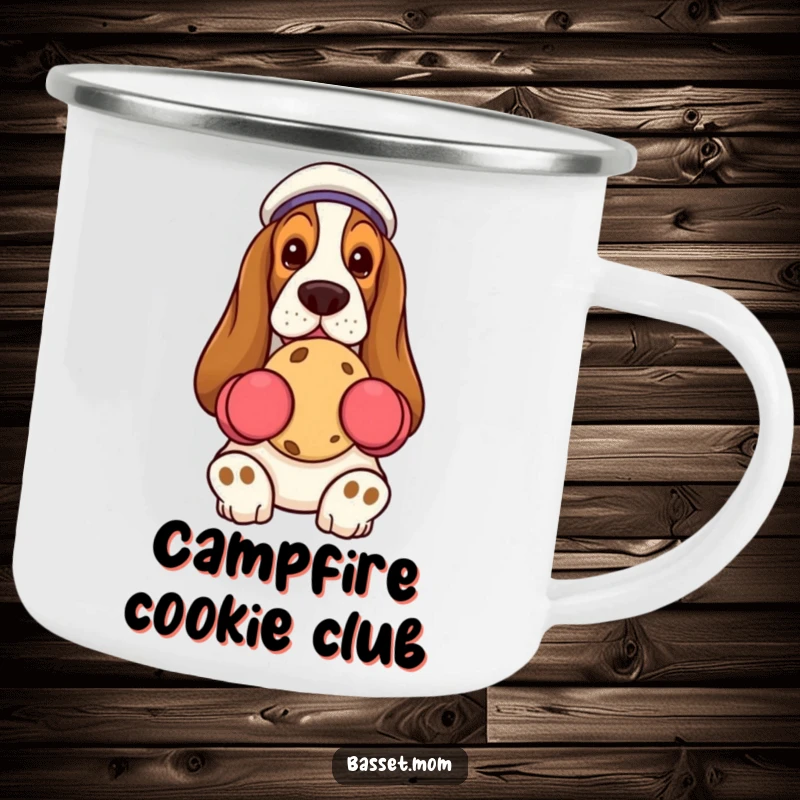 Funny Basset Hound holding cookie, oven mitts, metal enamel mug, humorous camping accessory.