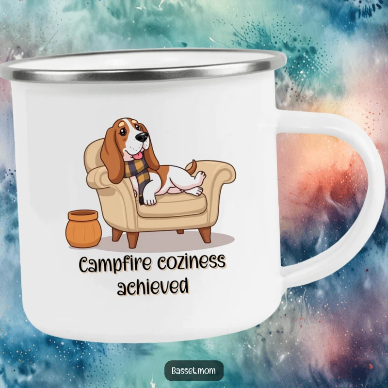 Funny Basset Hound wearing a scarf lounges on a cozy armchair, perfect for relaxing outdoor moments with this camping mug.