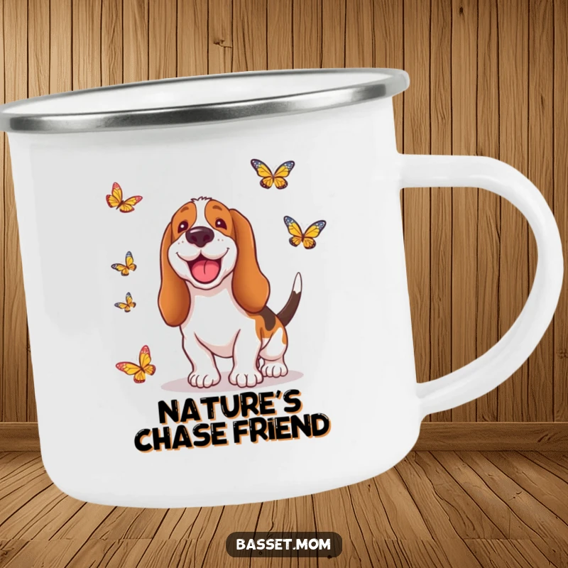Funny Basset Hound camping mug showing a dog with a silly grin, chasing butterflies in a natural setting, perfect for outdoor enthusiasts.