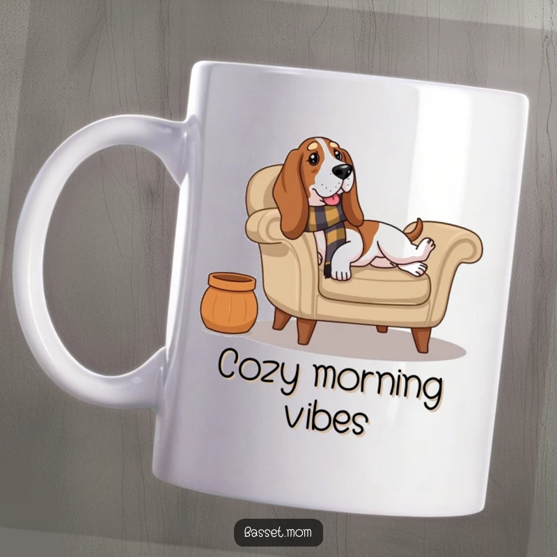 Funny Basset Hound wearing a scarf lounges contentedly on a plush armchair, radiating ultimate relaxation on this cozy mug.