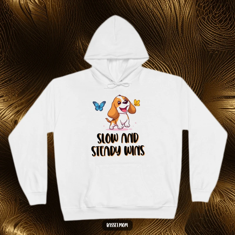 Funny Basset Hound Hoodie: A droopy-eared dog joyfully chasing a butterfly, guaranteed to bring smiles and warmth, a perfect funny gift.