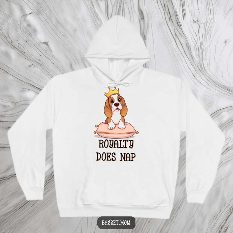 Funny Basset Hound hoodie, a crowned dog lounging regally on a cushion, exuding royal charm.