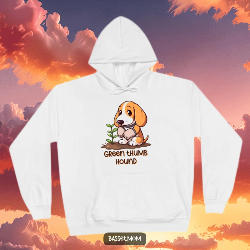 Funny Basset Hound wearing gardening gloves planting a tiny sprout, featured on a warm hoodie, offering cozy humor for garden lovers.