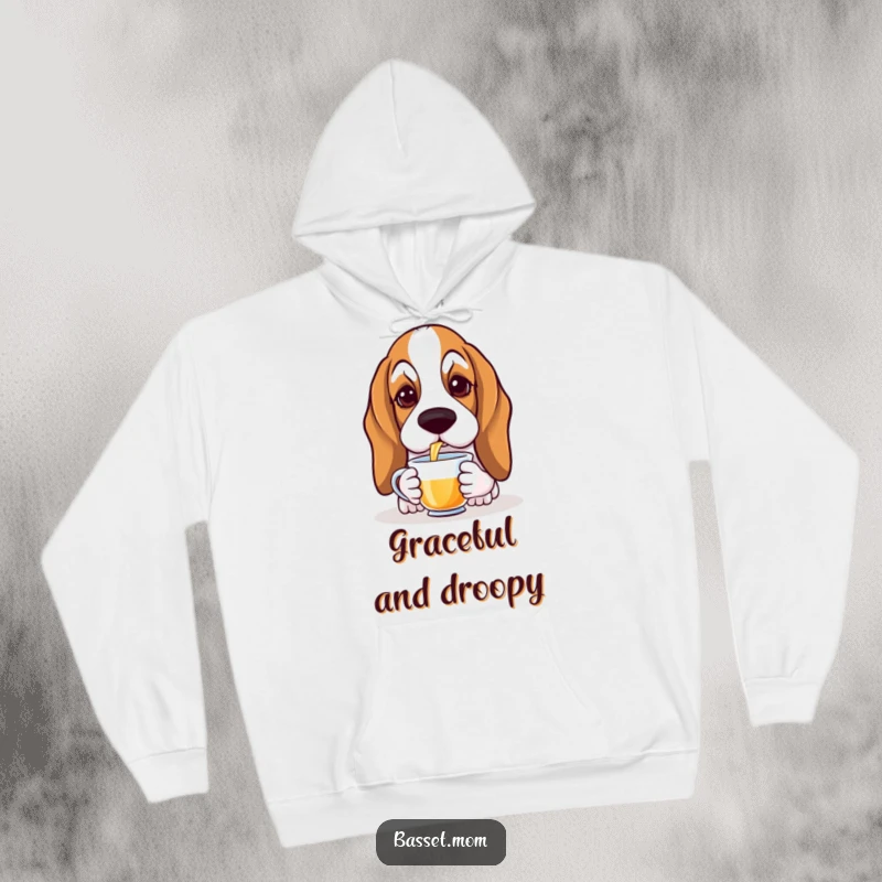 Funny Basset Hound hoodie depicting a droopy-eared dog with soulful eyes gracefully sipping tea, ideal for cozy, refined moments.