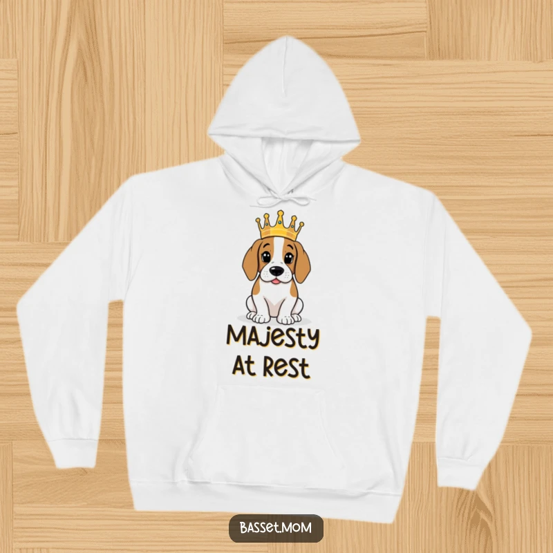 Funny Basset Hound wearing a tiny crown, surveying its kingdom, soft hooded sweatshirt, humorous pet gift.