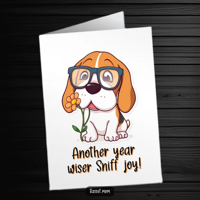 Funny Free Printable Birthday Card: A Basset Hound sports oversized glasses, sniffing a flower inquisitively, perfect for birthday wishes.