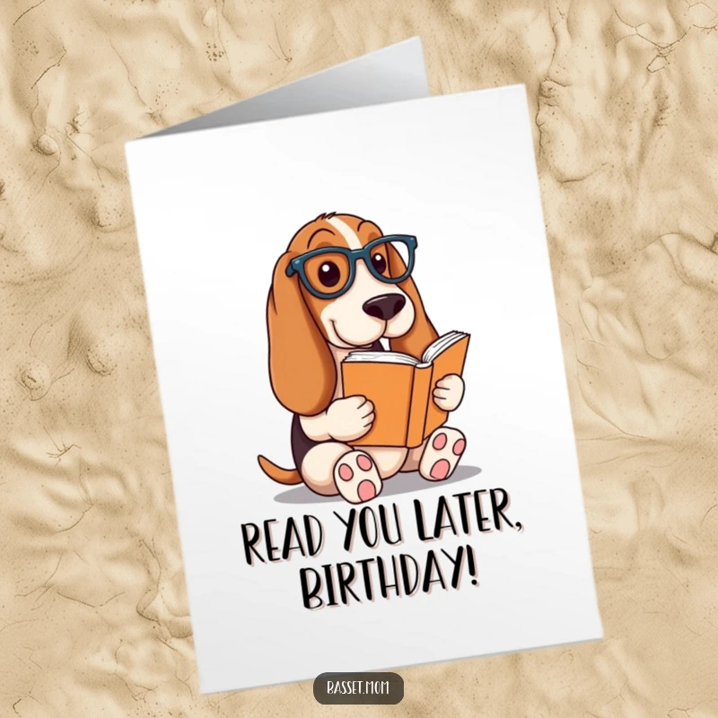 Funny Free Printable Birthday Card: A Basset Hound in reading glasses, completely engrossed in a book.