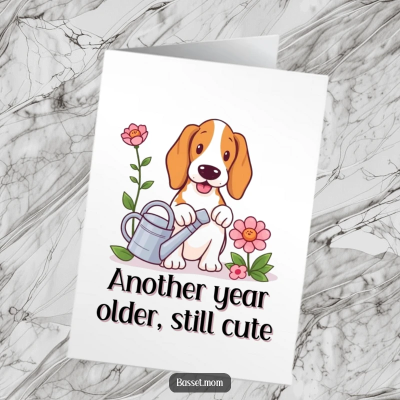 Funny Free Printable Birthday Card: Basset hound with tiny watering can, tending a large flower, cheerful downloadable art.