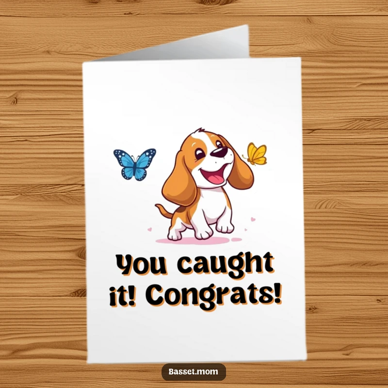Funny Free Printable Congratulations Card showing a Basset Hound with droopy ears gleefully chasing a butterfly, a perfect downloadable gift.