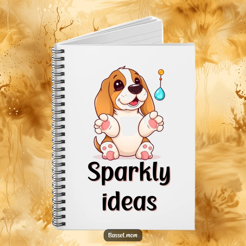 Funny Basset Hound notebook cover featuring a dog with paws up, playfully batting at a dangling jewel, inspiring creative and playful ideas.
