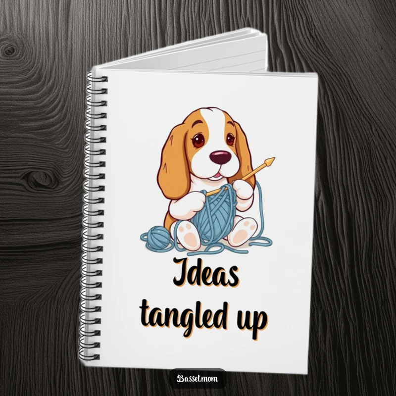 Funny Basset Hound notebook with a design of a dog tangled in yarn while attempting to knit, for jotting notes.