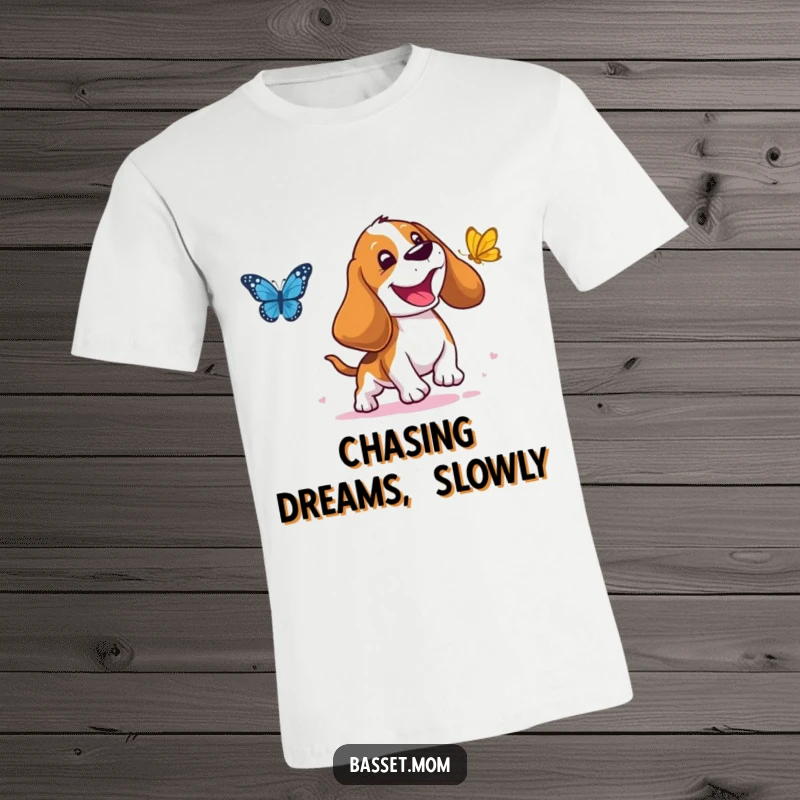 Funny Basset Hound T-Shirt: A droopy-eared dog joyfully chasing a butterfly, exuding happiness and perfect for a funny gift.