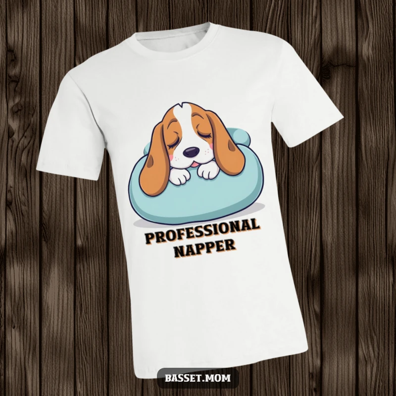 Funny Basset Hound t-shirt featuring a sleepy dog snuggling into a giant cushion, expressing ultimate comfort and relaxation readiness.