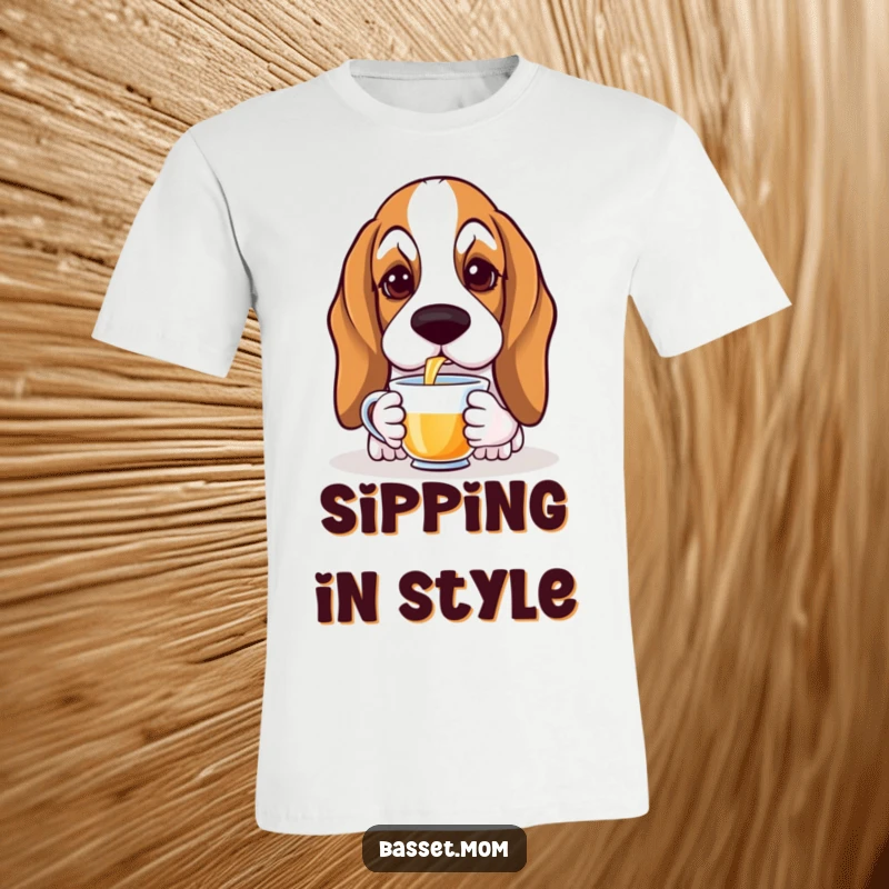 Funny Basset Hound t-shirt featuring a droopy-eared dog with soulful eyes gracefully sipping tea, exuding calm humor.