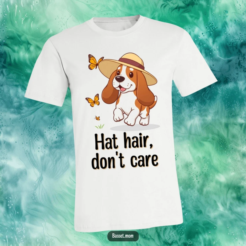 Funny Basset Hound t-shirt with a dog wearing a sun hat, playfully chasing a butterfly, embodying summer leisure and humor.