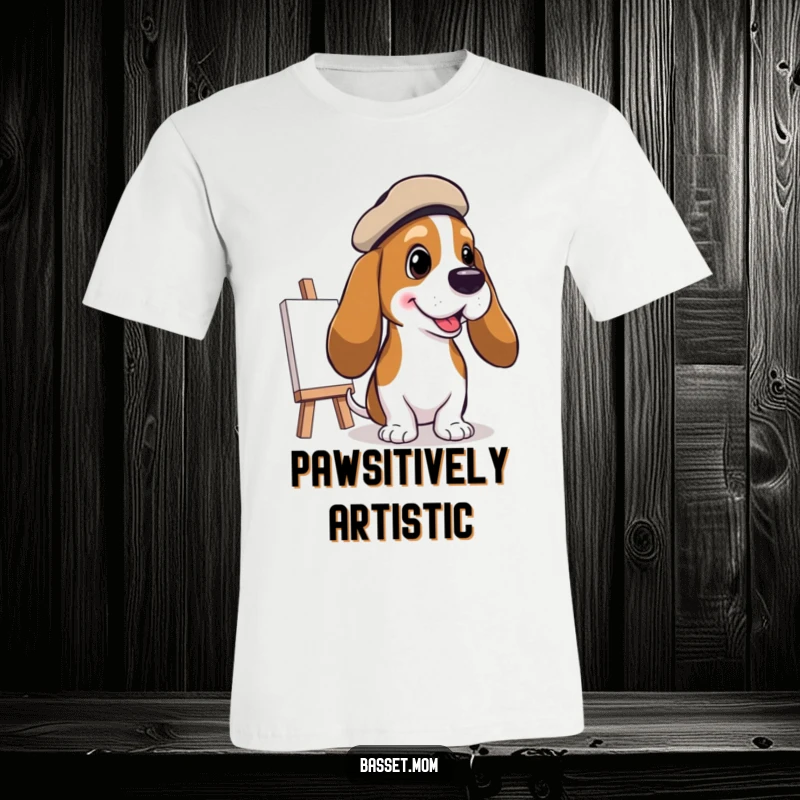 Funny Basset Hound Artist T-Shirt: A Basset hound in a beret paints a cheerful picture, showcasing artistic talent, perfect funny gift.
