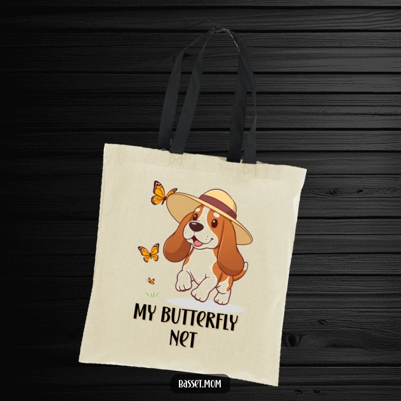 Funny Basset Hound tote bag with a dog in a sun hat playfully chasing a butterfly, perfect for carrying essentials with humor.